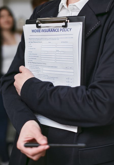 Person holding a detailed Bankrate - Home Insurance policy on a clipboard.